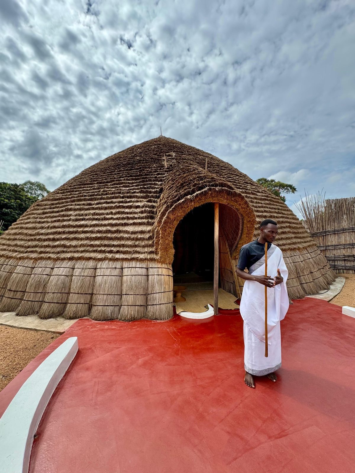 Guide in traditional dress at the King's Palace, Nyanza